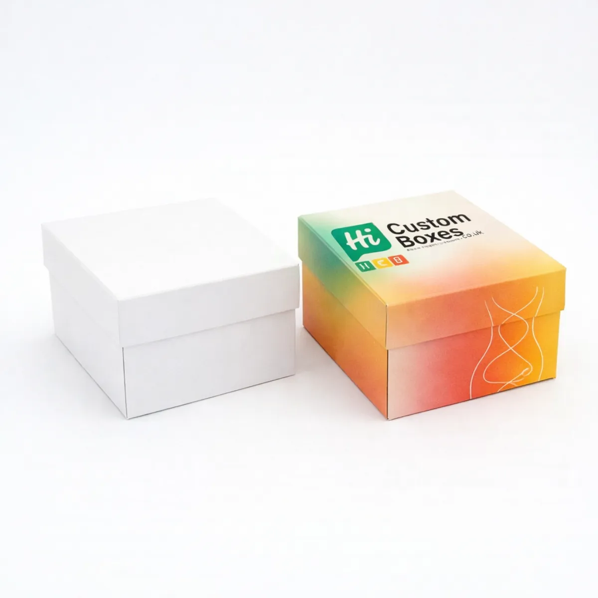 Two square rigid gift boxes- one plain white and one with vibrant sunset-coloured gradient branding- class=
